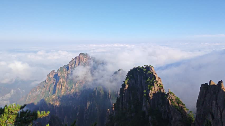 The beautiful Mount Huangshan Mountain in Anhui Province, China is surrounded by clouds and mist，High mountain clouds and mist, a fairyland on earth