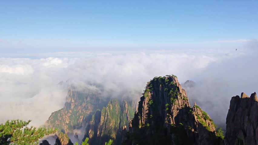 The beautiful Mount Huangshan Mountain in Anhui Province, China is surrounded by clouds and mist，High mountain clouds and mist, a fairyland on earth