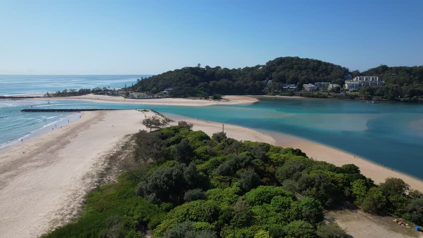 People Walking Along The Shore Of Lillson Beach Overlooking Currumbin Point In Gold Coast, QLD Australia. Aerial Shot