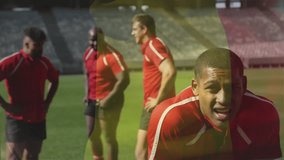 Animation of flag of belgium over diverse male rugby players resting at stadium. Global sport and patriotism concept, digitally generated video. - Powered by Shutterstock - Get 15% off with code: PIKWIZARD15