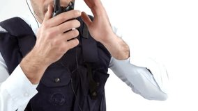 Animation of data processing and media icons over caucasian male security guard using walkie talkie. Global technology and digital interface concept, digitally generated video. - Powered by Shutterstock - Get 15% off with code: PIKWIZARD15