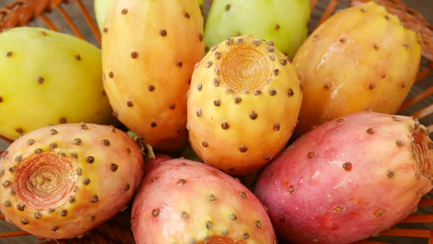 Prickly pear cactus fruits in a basket.
