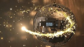Animation of shooting star over disco mirror ball on brown background. New years eve, party, festivity, celebration and tradition concept digitally generated video. - Powered by Shutterstock - Get 15% off with code: PIKWIZARD15