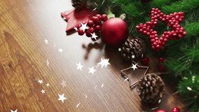 Christmas decorations with pine cones and red ornaments over falling stars animation. holiday, festive, celebration, winter, sparkle, magic - Powered by Shutterstock - Get 15% off with code: PIKWIZARD15