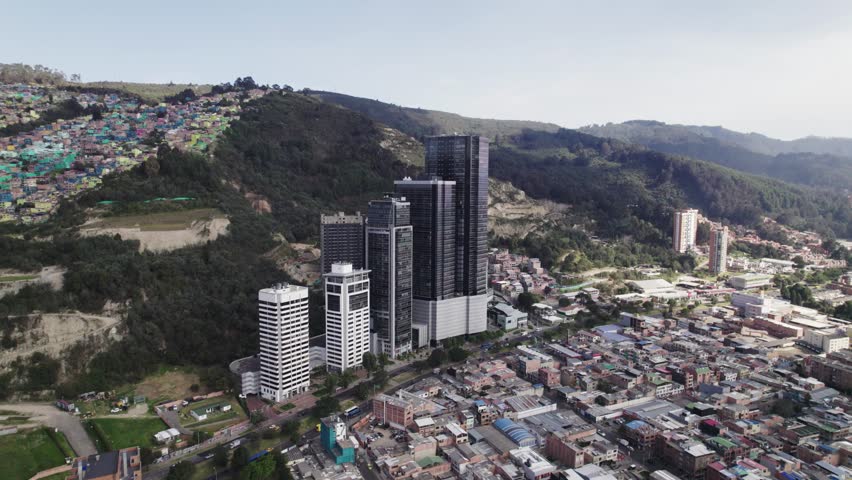 Orbit shot of cityscape and high buildings around Bogota, Colombia