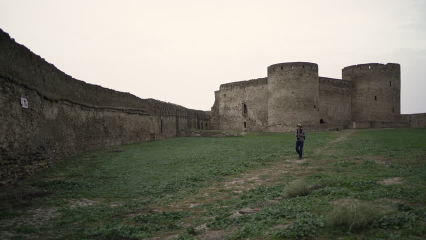 Retired male tourist in Akkerman fortress. Travel attractions and destinations