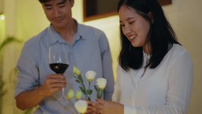 Woman set up the dinning table with flower and her boyfriend cheer up in behind. - Powered by Shutterstock - Get 15% off with code: PIKWIZARD15