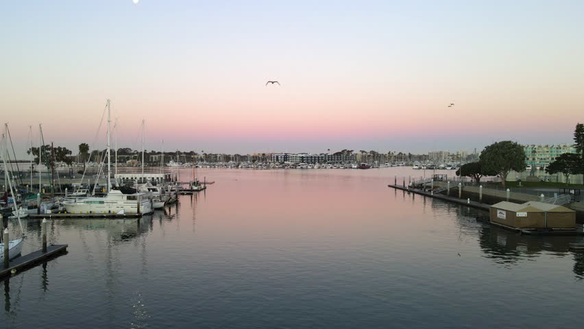Serene drone shot at the Long Beach pier during an early morning sunrise.