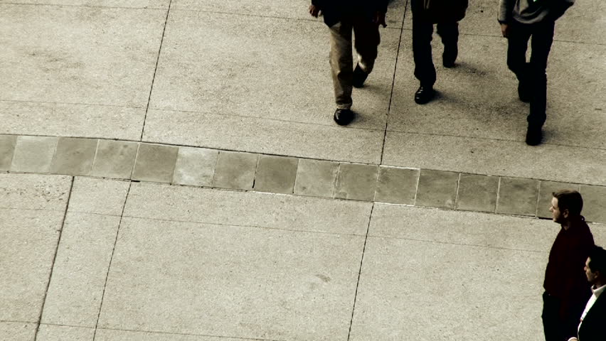 SAN FRANCISCO, CALIFORNIA - CIRCA 2012: Business men walking along sidewalk,