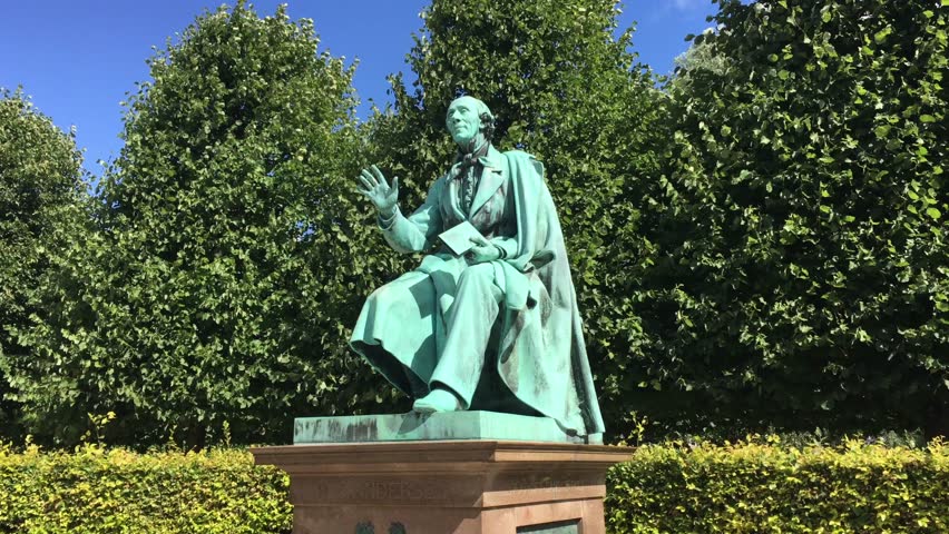 Bronze Statue of the world famous danish fairy tale writer Hans Christian Andersen standing in the Kings Garden in Copenhagen, Denmark