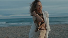 Beautiful Elderly Woman Walks Alone On Beach. Beautiful Woman Walks Near Sea. - Powered by Shutterstock - Get 15% off with code: PIKWIZARD15