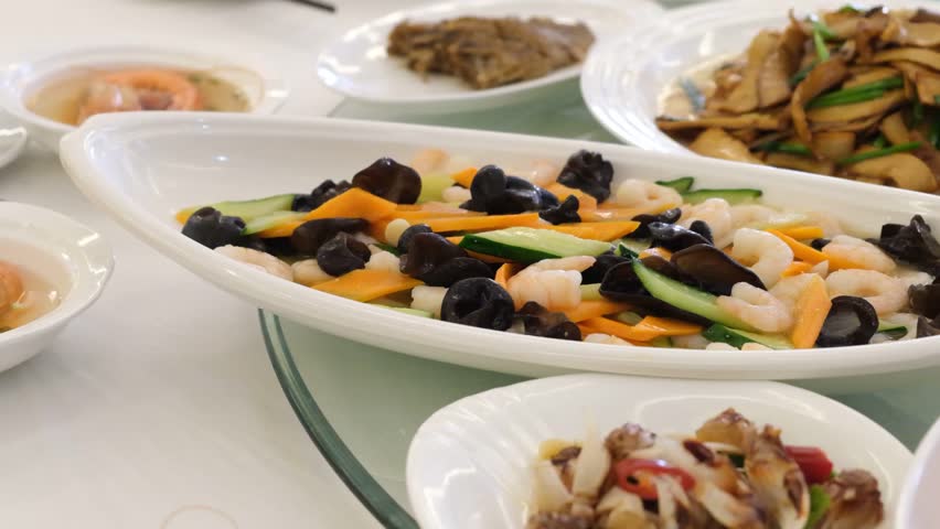 Serving Prawns, Shrimp, and Shredded Potatoes at a Wedding Banquet
