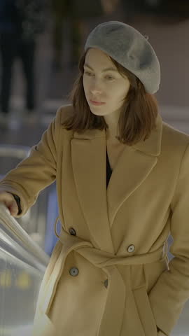 An Elegant and Stylish Woman Dressed in a Fashionable Winter Outfit at a Modern Location