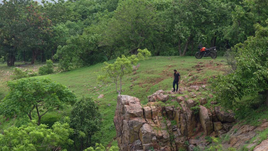 wide short of men climbing off the mountain on a stormy weather