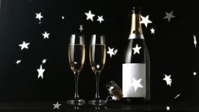 Animation of stars falling over glasses of champagne on black background. New year, celebration and digital interface concept digitally generated video. - Powered by Shutterstock - Get 15% off with code: PIKWIZARD15