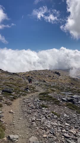 Cloudy over mountains on hiking trail to Mulhacen peak, Sierra Nevada National park, Andalusia, Spain