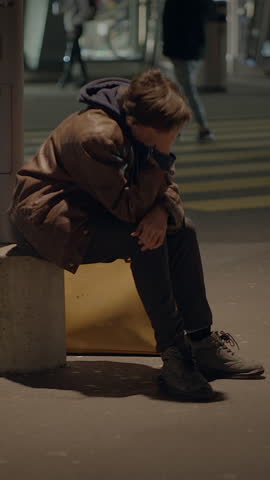 Thoughtful Young Man Lost at Trainstation Lonely Worried Waiting 
