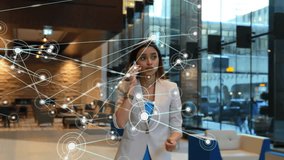 Animation of network of connections over biracial woman talking on smartphone. Global business, technology and digital interface concept, digitally generated video. - Powered by Shutterstock - Get 15% off with code: PIKWIZARD15