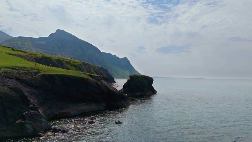 Trefor Sea Stacks, North Wales, Snowdonia: Cliffs, mountains (Gyrn Goch, Gyrn Ddu, Garn For), pebble beach, clear water, seabirds, and coastal scenery