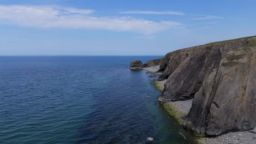 Trefor Sea Stacks, North Wales, Snowdonia: Cliffs, mountains (Gyrn Goch, Gyrn Ddu, Garn For), pebble beach, clear water, seabirds, and coastal scenery