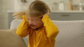 European little girl shake head naughty child crazy daughter kid pupil cover ears bad parenting hyperactive screaming noise childhood shout behaviour displeased dissatisfied emotional protest headshot - Powered by Shutterstock - Get 15% off with code: PIKWIZARD15