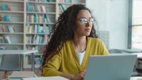 Latina Caucasian Hispanic woman student laptop desktop computer gadget technology cyberspace virtual project diploma typing library girl homework work e-learning female eyeglasses modern study smart - Powered by Shutterstock - Get 15% off with code: PIKWIZARD15