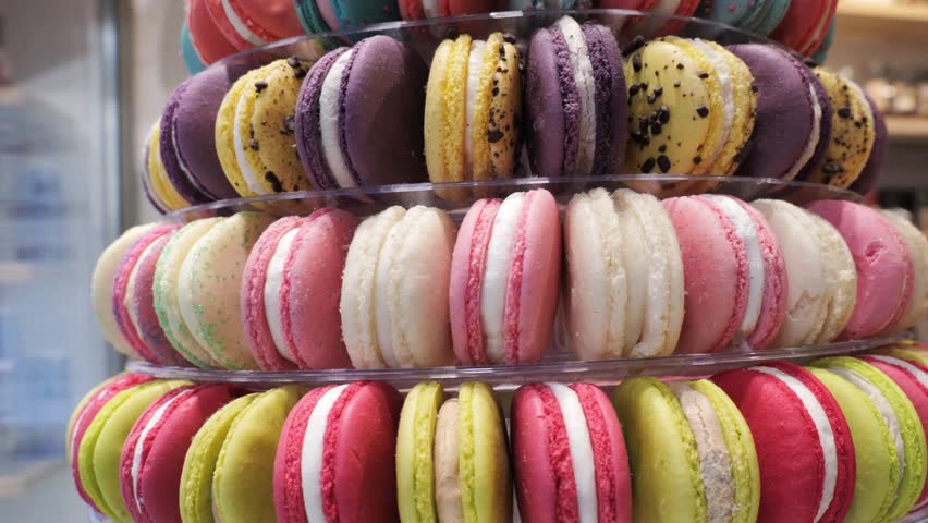 Delicious colorful macarons displayed in a bakery in Paris during spring