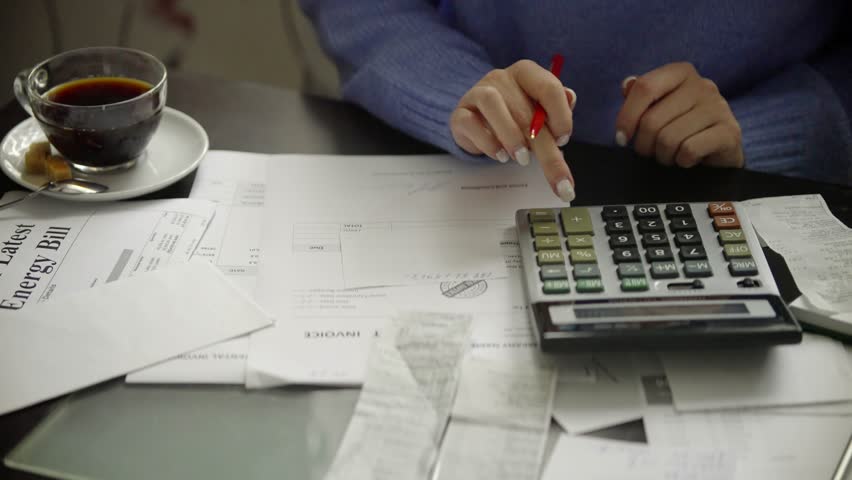 Family Tax Bill Debt Overspend. High Tax. Paying bills through on-line application using laptop,sorting out domestic, household papers. Planning family expenses manage budget, doing paperwork at home