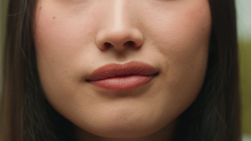 Extreme face details mouth close up sexy seductive lips unrecognizable Asian chinese woman girl female healthy lady happy smiling medical health care beauty cosmetology procedure skin care lips filler