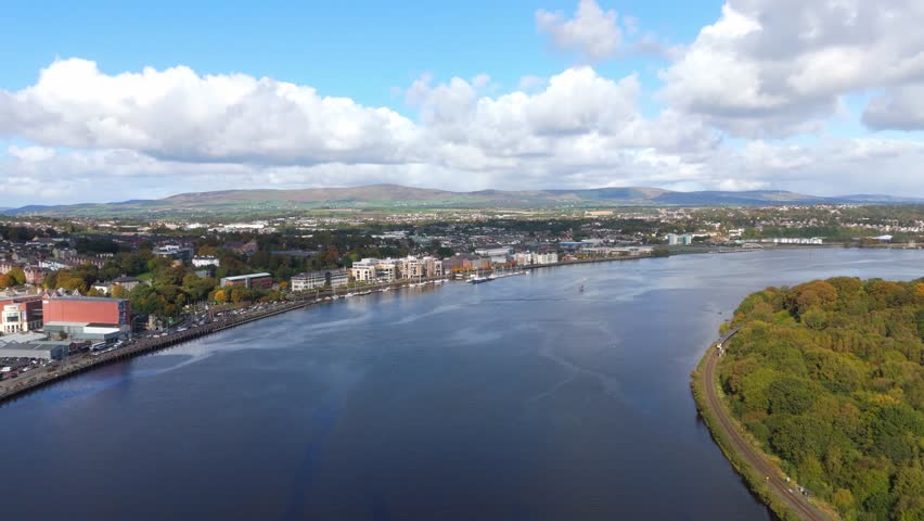 City of Derry aka Londonderry in Northern Ireland aerial view - A Beautiful Cityscape from above by the River Foyle Featuring the Beautiful Pedestrian Peace Bridge