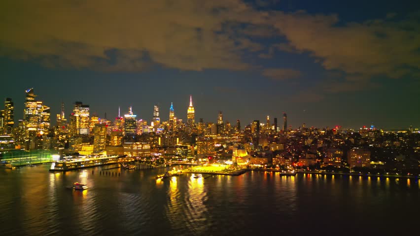 New York City Skyline at dusk night aerial view. NYC near night from drone. New York City skyline, cityscape of Manhattan in USA. Panoramic aerial view on Manhattan at night. Travel in USA.
