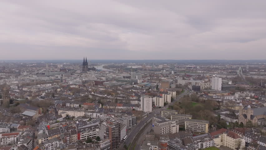 The urban landscape of Cologne, Germany from above, showcasing its iconic architecture and city view with the iconic Cathedral in the background