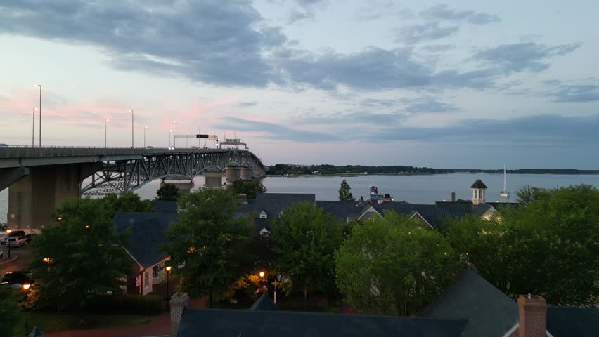 An aerial footage of the Coleman Memorial Bridge spans the York River between Yorktown and Gloucester Point at sunset in Virginia, United States