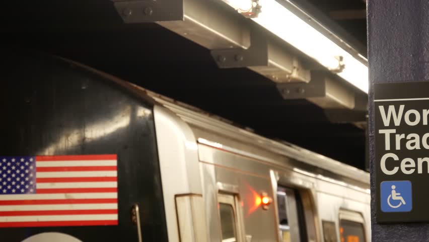 New York subway station interior, underground metropolitan platform sign. Metro railway train, passenger public transport, United States. Text signboard: World Trade Center. Oculus, Manhattan downtown