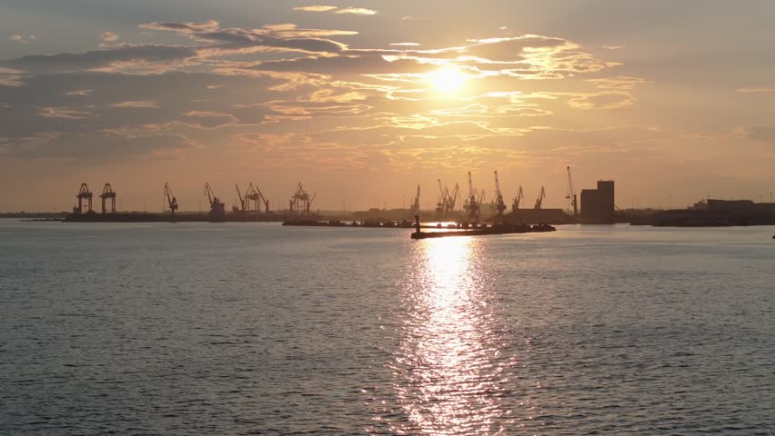 Cranes of the port of Thessaloniki, Greece at sunset