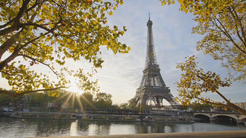 Beautiful view of famous Eiffel Tower one of the most iconic landmarks in France. Paris city center and river Seine at morning sunrise or sunset in autumn. Best travel destinations landmark in Europe.