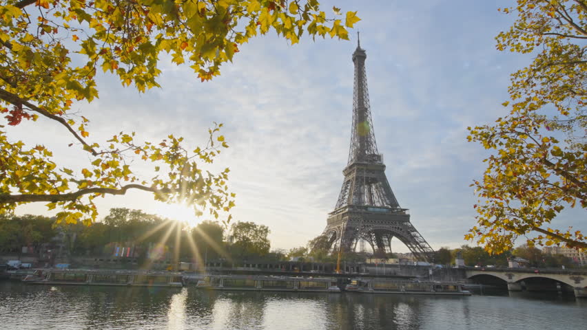 Beautiful view of famous Eiffel Tower one of the most iconic landmarks in France. Paris city center and river Seine at morning sunrise or sunset in autumn. Best travel destinations landmark in Europe.