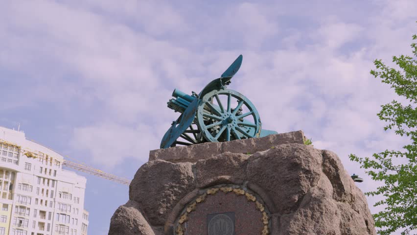 A low angle shot of the monument to Arsenal Plant workers against cloudy sky in Kyiv, Ukraine