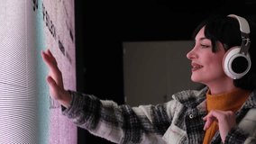 Young woman interacting with digital art installation - Powered by Shutterstock - Get 15% off with code: PIKWIZARD15