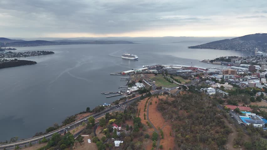 An aerial view of the River Derwent with a cruise ship arriving at Macquarie Point in the early morning in Hobart, Tasmania, Australia