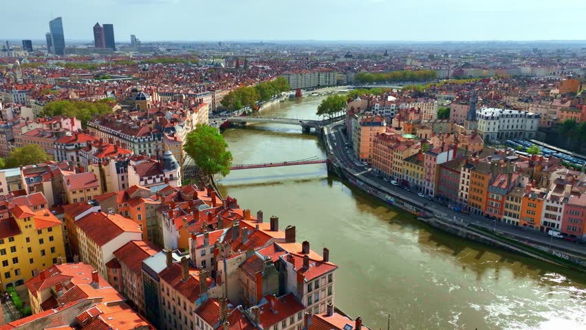 downtown Lyon aerial view, flying above historical city center of Lyon in France with Saone river, establishing shot of the French city of Lyon 