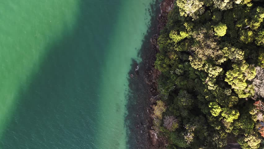 People at sandy skulls beach on Langkawi. Gorgeous aerial view flight drone