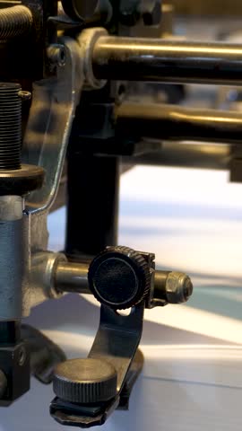 Printing machine printing paper in typography. Newspaper or tabloid print on plant factory, conveyor belt line after printing