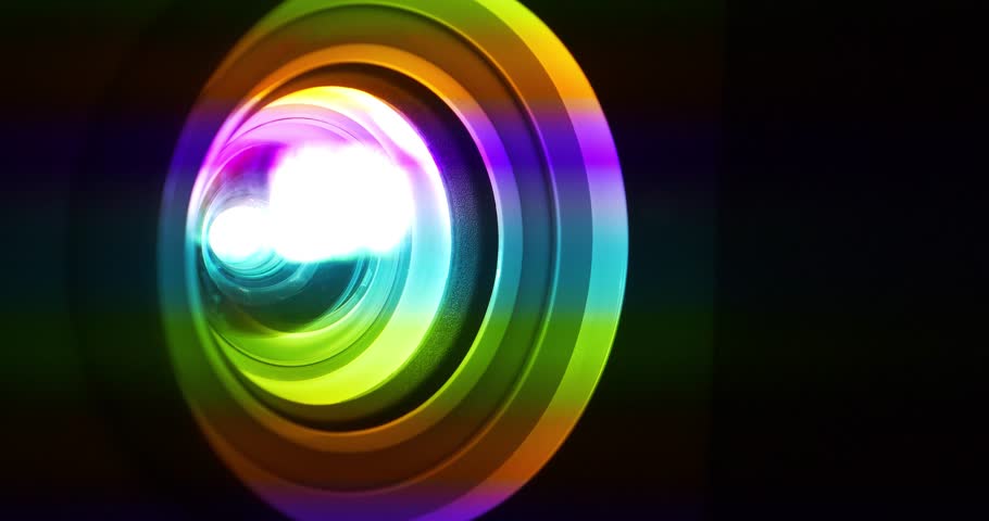 Projector lens in operation. Spectral decomposition of light. Dispersion - decomposition of light into spectral colors. Cinema 4K 60fps close-up shot video