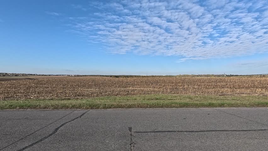 Roadside view and road, landscape and field, view from the car window