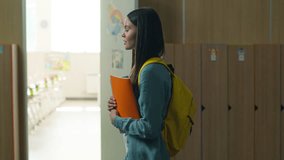 Caucasian girl female woman student pupil schoolgirl lady learn education study learning studying walking in school walk in university college corridor holding copybook textbook go to class lesson - Powered by Shutterstock - Get 15% off with code: PIKWIZARD15