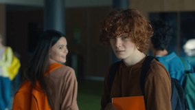 Caucasian male man guy pupil student schoolboy teenager walking going in corridor hallway in university college school sad upset bullying couple pupils teenagers push bully violence studying problem - Powered by Shutterstock - Get 15% off with code: PIKWIZARD15