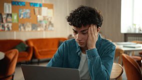 Tired stressed headache overworked sad upset Caucasian male student guy pupil boy teen teenager studying laptop learning online education internet homework prepare to exams school college university - Powered by Shutterstock - Get 15% off with code: PIKWIZARD15