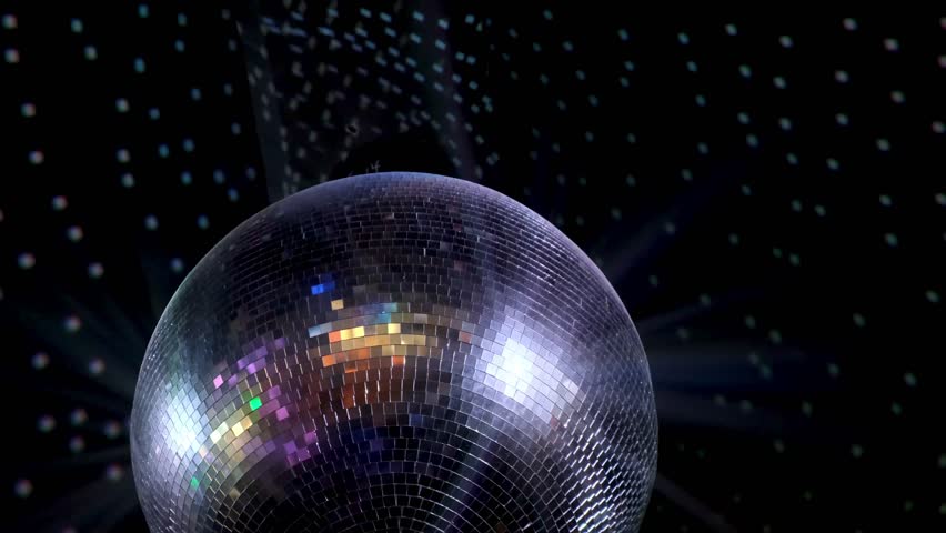 Closeup disco ball hanging at night party. Mirrored sphere reflecting modern nightclub vibes with chic glimmer. Discotheque equipment with reflecting lights rotating in club. Mirror discoball spinning