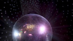 Closeup disco ball hanging at night party. Mirrored sphere reflecting modern nightclub vibes with chic glimmer. Discotheque equipment with reflecting lights rotating in club. Mirror discoball spinning - Powered by Shutterstock - Get 15% off with code: PIKWIZARD15